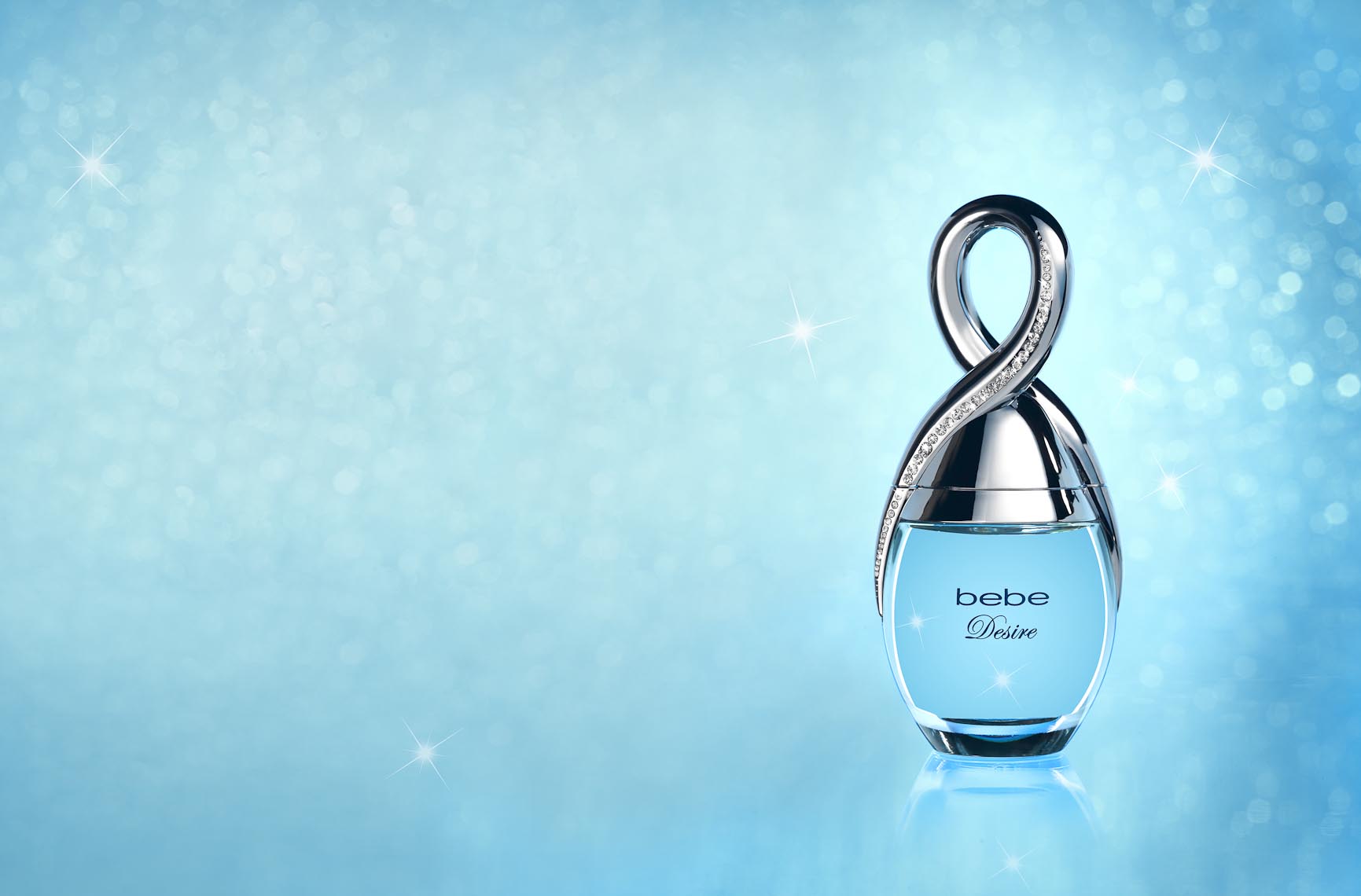 Cosmetics, Bebe Desire Perfume Bottle on Blue - Mike Lorrig